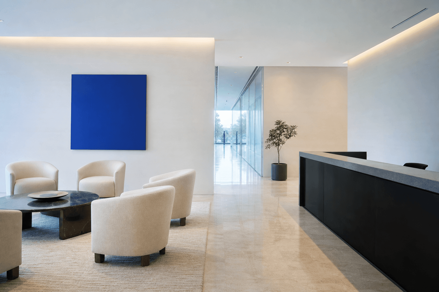 A calm white corporate reception lounge with a cobalt artwork